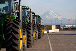 In this Nov. 4, 2019 file photo, John Deere tractors made by Deere & Company are shown as they are readied for export to Asia at the Port of Tacoma in Tacoma, Wash. The U.S. trade deficit fell in September 2020 after hitting a 14-year high in August as exports outpaced imports. The Commerce Department reported, Wednesday, Nov. 4, 2020, the gap between what the U.S. sells and what it buys abroad fell to 63.9 billion in September, a decline of 4.7% from a $67 billion deficit in August.