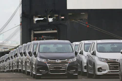 Cars wait to be exported at Yokohama port, near Tokyo.