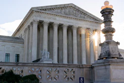 In this Nov. 10 photo, the sun rises behind the U.S. Supreme Court in Washington.