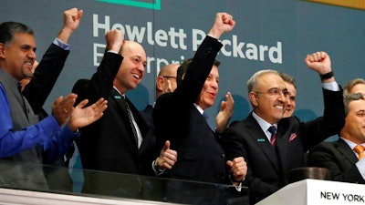 Hewlett Packard Enterprise President & CEO Antonio Neri, right, rings the New York Stock Exchange opening bell.