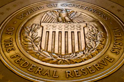 This Feb. 5, 2018 photo shows the seal of the Board of Governors of the United States Federal Reserve System in the ground at the Marriner S. Eccles Federal Reserve Board Building in Washington.