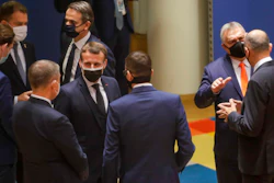 French President Emmanuel Macron, center, speaks with Czech Republic's Prime Minister Andrej Babis, third left, and Poland's Prime Minister Mateusz Morawiecki, center right, during a round table meeting at an EU summit at the European Council building in Brussels, Thursday, Dec. 10, 2020.