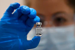A nurse holds a phial of the Pfizer-BioNTech COVID-19 vaccine at Guy's Hospital in London.
