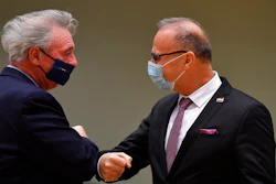 Luxembourg's Foreign Minister Jean Asselborn, left, greets Croatia's Foreign Minister Gordan Grlic Radman with an elbow bump during a meeting of EU Foreign Ministers at the European Council building in Brussels, Monday Dec. 7, 2020. European Union foreign ministers were meeting to discuss making a fresh start to relations with the United States under President-elect Joe Biden, the fallout from weekend elections in Venezuela and tense ties with Turkey.