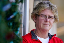 Keli Paaske stands outside her home in Olathe, Kan. Friday, Dec. 4, 2020. Paaske was laid off in August from a company supplying fire doors to hospitals after being furloughed for five months and has struggled to find a new job.