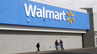 People shop at a Walmart Thursday, Feb. 6, 2020, in El Paso, Texas. The Justice Department is suing Walmart, alleging the company unlawfully dispensed controlled substances through its pharmacies, helping to fuel the opioid crisis in America, a person familiar with the matter told The Associated Press. The civil complaint being filed Tuesday, Dec. 22, 2020 points to the role Walmart’s pharmacies may have played in the crisis by filling opioid prescriptions and by unlawfully distributing controlled substances to the pharmacies during the height of the opioid crisis, the person said.