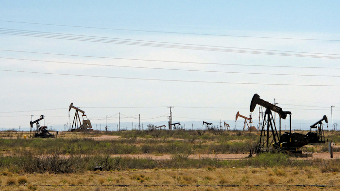 This file phot shows oil rigs in a Loco Hills field on U.S. Highway 82 in Eddy County near Artesia, N.M.