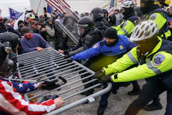Trump supporters try to break through a police barrier on Wednesday at the Capitol in Washington.