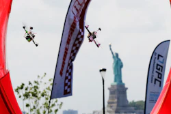 Pilots fly racing drones through an obstacle course for the National Drone Racing Championship, Governors Island, N.Y., Aug. 5, 2016.