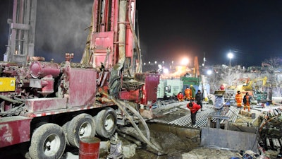 Rescuers drill a new channel at the explosion site of a gold mine in Qixia City, China, Jan. 18, 2021.