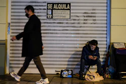 A homeless with his dog in Pamplona, Spain, Jan. 21, 2021.