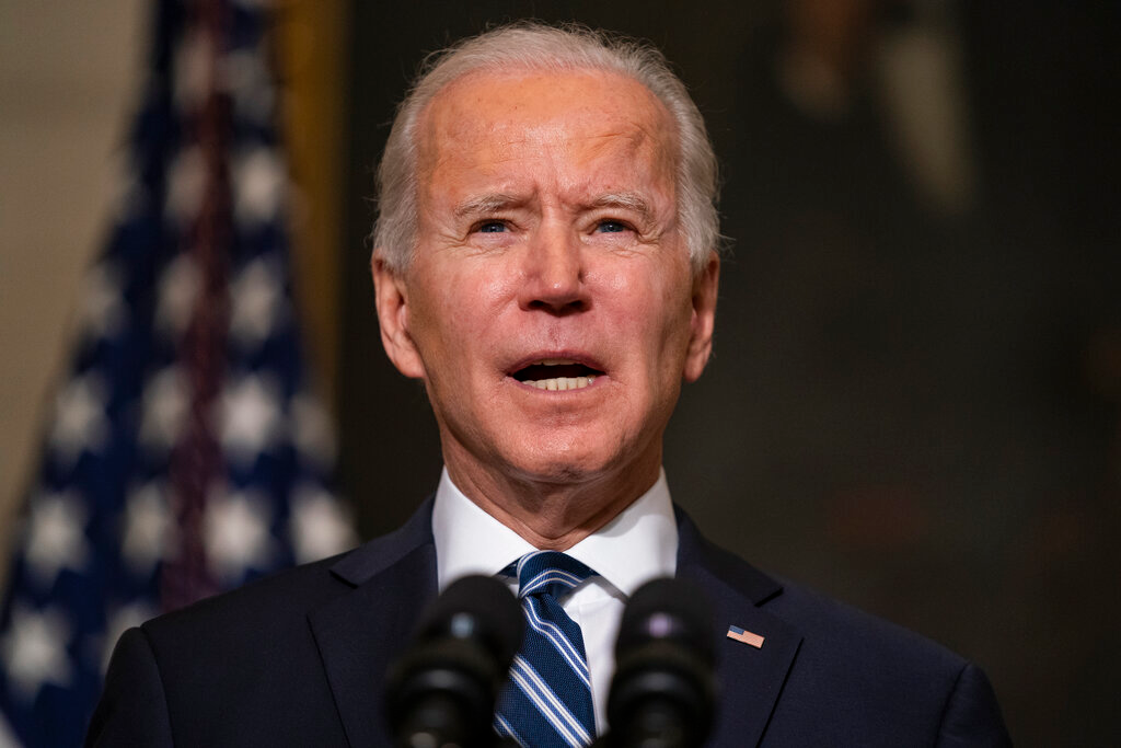 President Joe Biden speaks in the State Dining Room of the White House, Jan. 27, 2021.