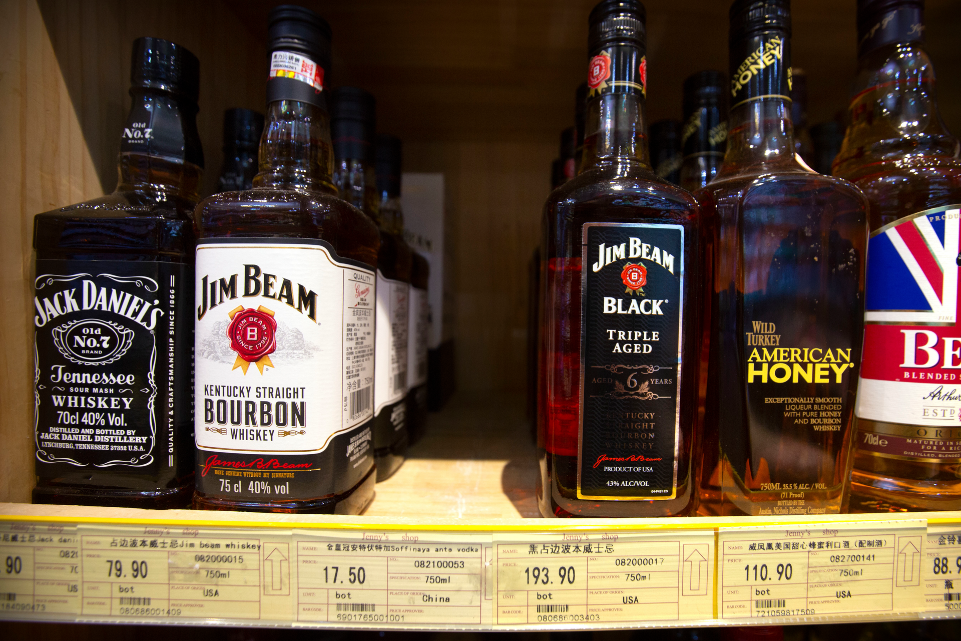 In this July 7, 2018 file photo, whiskeys distilled and bottled in the U.S. are displayed for sale in a grocery store in Beijing.