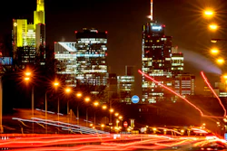 Long time exposure photo shows commuters driving towards Frankfurt, Germany, Thursday, Jan. 14, 2021. In background the buildings of the banking district.