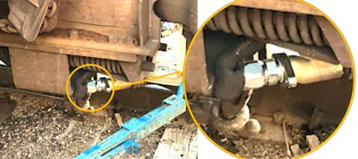 Kinked intermediate end-of-railcar air hose that was discovered during an inspection after an end-of-railcar air hose arrangement was incorrectly applied.
