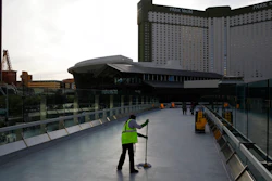 A worker cleans along the Las Vegas Strip, March 31, 2020.