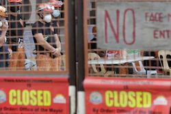 Rescuers stand inside the compound of the TP Marcelo Ice Plant in Navotas, Philippines. An ammonia leak from the ice plant in the Philippine capital region left some dead and more than 90 injured or sickened.