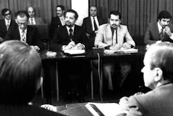 In this Oct. 8, 1973, file photo, oil ministers of six Persian Gulf countries and representatives of western nations meet in Vienna, Austria, to negotiate price boosts sought by oil producers. Facing each other, are from left to right, Dr. Jamshid Amouzegar, then Iran Finance Minister, then Saudi Oil Minister Ahmed Zaki Yanani. Yamani, a long-serving oil minister in Saudi Arabia who led the kingdom through the 1973 oil crisis, the nationalization its state energy company and later found himself kidnapped by the assassin Carlos the Jackal, died Tuesday, Feb. 23, 2021, in London. He was 90.