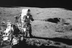 Apollo 14 astronaut Alan Shepard conducts an experiment near a lunar crater, Feb. 6, 1971.