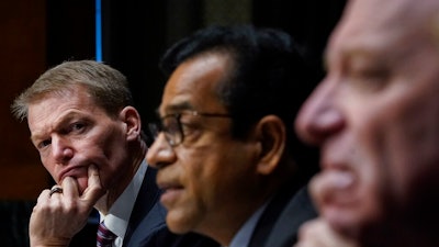 FireEye CEO Kevin Mandia, SolarWinds CEO Sudhakar Ramakrishna and Microsoft President Brad Smith testify during a Senate Intelligence Committee hearing on Capitol Hill on Tuesday, Feb. 23, 2021 in Washington.