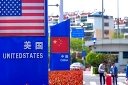 Display boards featuring the U.S. and Chinese flags in a special trade zone in Qingdao, China, May 8, 2019.