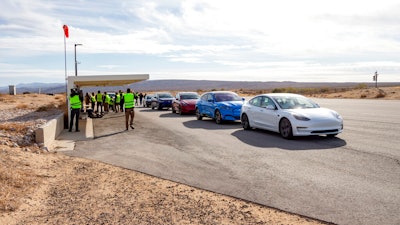Five electric vehicles at a test track in California's Mojave Desert.
