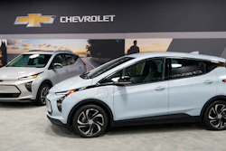 The 2022 Bolt EV, foreground, and EUV are displayed, Thursday, Feb. 11, 2021, in Milford, Mich. Whether people want them or not, automakers are rolling out multiple new electric vehicle models as the auto industry responds to stricter pollution regulations worldwide and calls to reduce emissions to fight climate change.