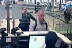 This image from security camera video shows Michael L. Taylor, center, and George-Antoine Zayek at passport control at Istanbul Airport in Turkey.