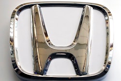 This Feb. 14, 2019 file photo shows a Honda logo at the 2019 Pittsburgh International Auto Show in Pittsburgh. Honda has plans to sell two all-electric SUVs in the U.S. for the 2024 model year, and it soon will offer hybrid gas-electric versions of its top-selling models. The announcements Thursday, March 11, 2021 come as the automaker acknowledges it has work to do to comply with emissions-reduction targets that will be coming from the Biden administration, and a California ban on sales of new internal-combustion vehicles by 2035.