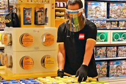 In this Monday, June 15, 2020 file photo, an employee wearing protective gear arrange boxes of Lego at a toy store at the Senayan City, in Jakarta, Indonesia. Sales of Lego sets surged in 2020 as more children stayed home during global pandemic lockdowns - and parents bought the colorful plastic brick toys to keep them entertained during weeks of isolation. The privately-held Danish company said its net profit rose 19% to 9.9 billion kroner ($1.6 billion) as sales jumped 21% and it grew its presence in its 12 largest markets.