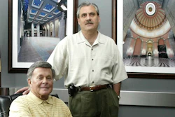 In this file photo Paul Tipps, left, and Neil Clark, pose in their office in Columbus, Ohio.