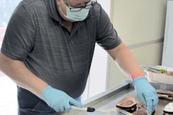 Mack Manufacturing Supervisor John Tidd grills corned beef Reuben sandwiches for employees at the Company’s East Arlington Road facility, in Arlington, Vt., Wednesday, March 17, 2021, in honor of the plant reaching 1,000 days without a lost-time accident.