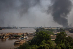 Black smoke billows from the industrial zone of Hlaing Thar Yar township in Yangon, Myanmar Sunday, March 14, 2021.