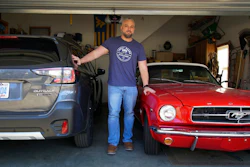 Steve Bock stands between his new Subaru Outback and his 1965 Ford Mustang at his home in Apex, N.C., on Friday, March 5, 2021. He would like to have an electric car, but says the prices will have to come down a lot before he can do it. Opinion polls show that most Americans would consider an EV if it cost less, if more charging stations existed and if a wider variety of models were available.
