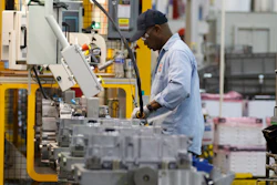 An autoworker assembles a transmission at the General Motors Transmission Plant in Toledo, Ohio.
