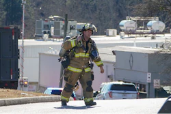 A Hall County firefighter leaves following a liquid nitrogen leak that killed six people at Prime Pak Foods, a poultry plant on Thursday, Jan. 28 in Gainesville, GA.