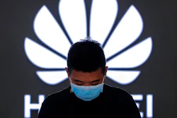Employee inside a Huawei store in Beijing, Aug. 31, 2020.