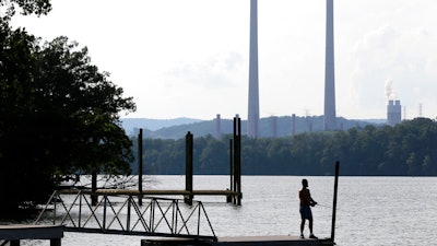 A man fishes at William B. Ladd Park near the Kingston Fossil Plant, Kingston, Tenn., Aug. 7, 2019.