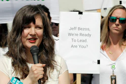 Emily Cunningham, left, speaks as Kathryn Dellinger, right, looks on during a news conference following Amazon's annual shareholders meeting, Wednesday, May 22, 2019, in Seattle.