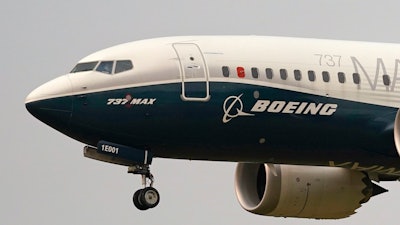 In this file photo a Boeing 737 Max jet prepares to land at Boeing Field following a test flight.