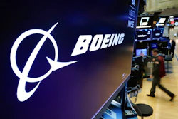 In this March 11, 2019 file photo, the Boeing logo appears above a trading post on the floor of the New York Stock Exchange before the opening bell. Boeing is suing a subcontractor it hired to work on new Air Force One planes that will carry the president of the United States. Boeing says a subcontractor on in Fort Worth, Texas, missed deadlines for work on the planes.