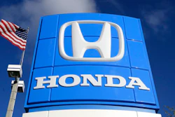 This Tuesday, Jan. 13, 2015, file photo shows a sign at a Honda dealership in Miami Lakes, Fla. Japanese automaker Honda said Friday, April 23, 2021 that it plans to phase out all of its gasoline-powered vehicles in North America by 2040, making it the latest major automaker with a goal of becoming carbon neutral. The announcement came as leaders of the major global economies met for President Joe Biden's climate summit.