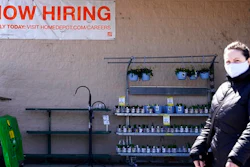 A hiring sign is seen outside home improvement store in Mount Prospect, Ill., Friday, April 2, 2021. The pace of job openings reached the highest level on record in February, a harbinger of healthy hiring and a hopeful sign for those looking for work.