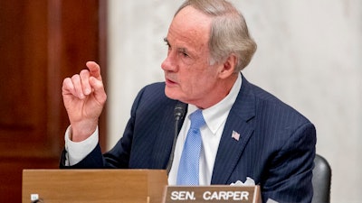 In this May 20, 2020, file photo, Sen. Tom Carper, D-Del., speaks as the Senate Homeland Security and Governmental Affairs committee meets on Capitol Hill in Washington. Sen. Carper is urging U.S. anti-pollution standards that would follow a deal brokered by California with five automakers and then set targets to end sales of new gas-powered vehicles by 2035. In a letter sent late Thursday, April 29, 2021, to the Environmental Protection Agency, Carper says the administration must move forcefully in the auto sector to achieve Biden’s plan of slashing America’s greenhouse gas emissions in half by 2030.