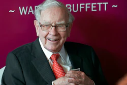 In this May 5, 2019, file photo Warren Buffett, Chairman and CEO of Berkshire Hathaway, smiles as he plays bridge following the annual Berkshire Hathaway shareholders meeting in Omaha, Neb. A multitude of big-name businesses and high-profile individuals, including Buffett, Amazon and Facebook are showing their support for voters’ rights. In a letter published in The New York Times, the group stressed that Americans should be allowed to cast ballots for the candidates of their choice. “For American democracy to work for any of us, we must ensure the right to vote for all of us,” they wrote.