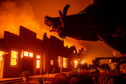 In this file photo, flames from the Kincade Fire consume Soda Rock Winery in Healdsburg, California.