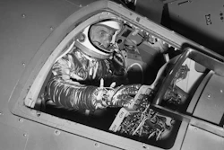 Marine Lt. Col. John Glenn reaches for controls inside a Mercury capsule procedures trainer, NASA Research Center, Langley Field, Va., Jan. 11, 1961.