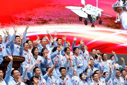 Members at the Beijing Aerospace Control Center celebrate after China's Tianwen-1 probe successfully landed on Mars, May 15, 2021.