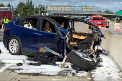Emergency personnel work at the scene where a Tesla SUV crashed into a barrier on U.S. Highway 101, Mountain View, Calif., March 23, 2018.