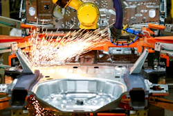 In this June 24, 2019, file photo machines work on a Ford vehicle assembly line at Ford's Chicago Assembly Plant in Chicago.